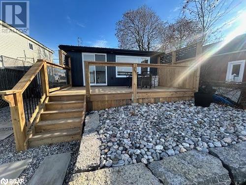 View of home's exterior with a water view - 80 Ridley Street, Prince Edward County, ON - Outdoor With Deck Patio Veranda