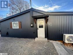 View of exterior entry featuring ac unit - 