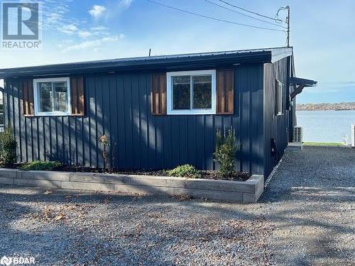 View of home's exterior with a water view - 80 Ridley Street, Prince Edward County, ON - Outdoor