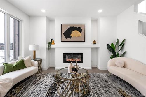 71 Bridgehampton Bay, Winnipeg, MB - Indoor Photo Showing Living Room With Fireplace