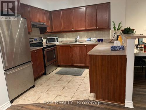 616 - 3880 Duke Of York Boulevard, Mississauga, ON - Indoor Photo Showing Kitchen With Stainless Steel Kitchen With Double Sink