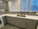 206 - 3695 Kaneff Crescent, Mississauga, ON  - Indoor Photo Showing Kitchen With Double Sink 