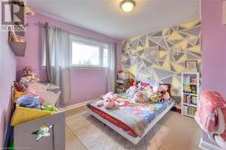 Bedroom featuring light carpet - 