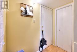 BASEMENT UNIT Hallway featuring light laminate flooring - 