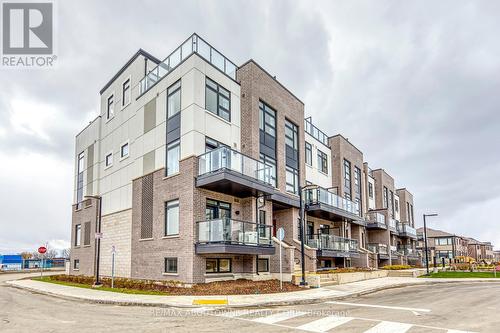 101 - 1565 Rose Way, Milton, ON - Outdoor With Balcony With Facade