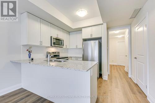 101 - 1565 Rose Way, Milton, ON - Indoor Photo Showing Kitchen With Stainless Steel Kitchen With Double Sink