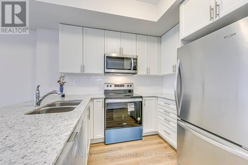 101 - 1565 Rose Way, Milton, ON - Indoor Photo Showing Kitchen With Stainless Steel Kitchen With Double Sink With Upgraded Kitchen