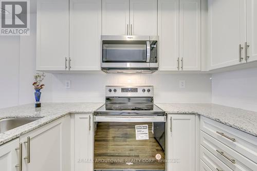 101 - 1565 Rose Way, Milton, ON - Indoor Photo Showing Kitchen With Upgraded Kitchen