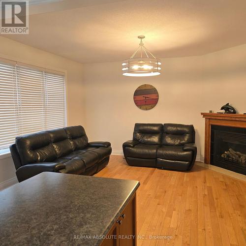 A - 3038 Freshwater Way W, Ottawa, ON - Indoor Photo Showing Living Room With Fireplace