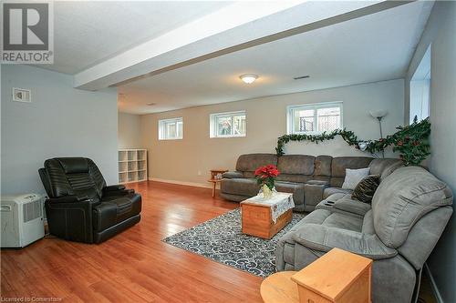 family room featuring hardwood / wood-style flooring - 220 Bankside Drive, Kitchener, ON - Indoor Photo Showing Living Room