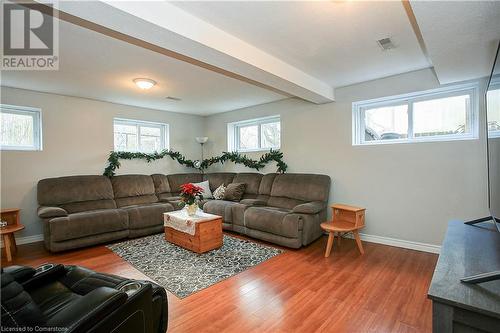 family room featuring plenty of natural light and hardwood / wood-style flooring - 220 Bankside Drive, Kitchener, ON - Indoor Photo Showing Living Room