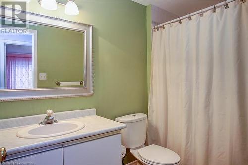 Bathroom featuring vanity and toilet, tub - 220 Bankside Drive, Kitchener, ON - Indoor Photo Showing Bathroom