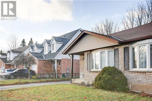 View of front of property with a front lawn - 220 Bankside Drive, Kitchener, ON - Outdoor