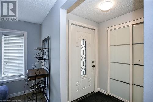 Foyer featuring a textured ceiling - 220 Bankside Drive, Kitchener, ON - Indoor Photo Showing Other Room