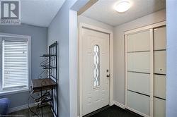 Foyer featuring a textured ceiling - 