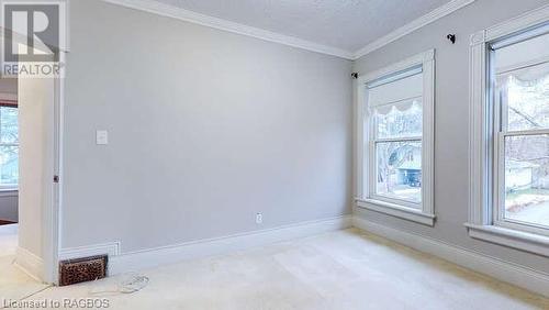 Carpeted spare room with ornamental molding - 550 10Th Street A West, Owen Sound, ON - Indoor Photo Showing Other Room