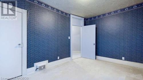 Spare room featuring a textured ceiling - 550 10Th Street A West, Owen Sound, ON - 