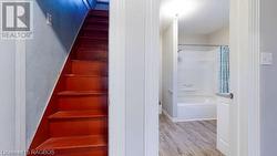 Stairway with hardwood / wood-style flooring - 