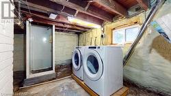 Laundry room featuring independent washer and dryer - 