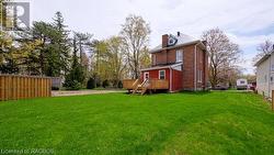 View of yard with a wooden deck - 