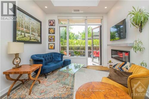 102 - 530 De Mazenod Avenue, Ottawa, ON - Indoor Photo Showing Living Room With Fireplace