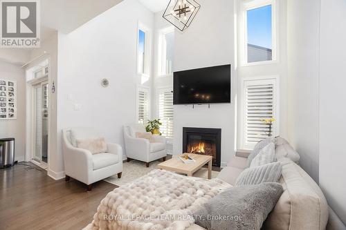 284 Dolce Crescent, Ottawa, ON - Indoor Photo Showing Living Room With Fireplace