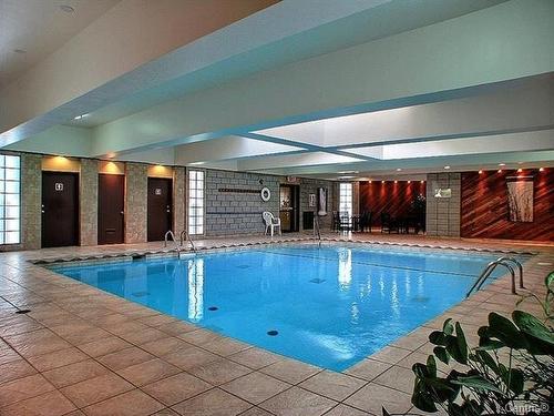 Piscine - 909-2555 Av. Du Havre-Des-Îles, Laval (Chomedey), QC - Indoor Photo Showing Other Room With In Ground Pool