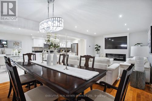 3070 Meadowgate Boulevard, London, ON - Indoor Photo Showing Dining Room With Fireplace