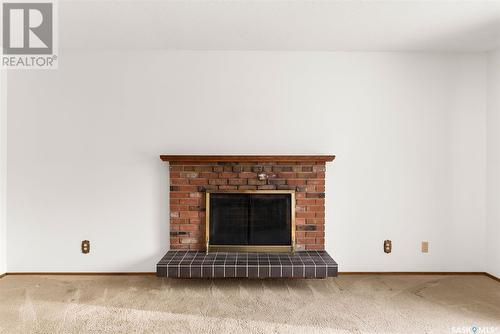 27 Laubach Avenue, Regina, SK - Indoor Photo Showing Living Room With Fireplace