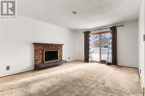 27 Laubach Avenue, Regina, SK - Indoor Photo Showing Living Room With Fireplace