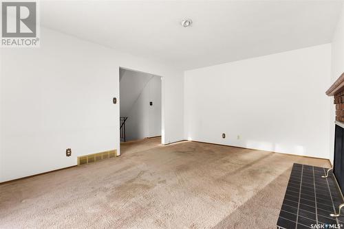 27 Laubach Avenue, Regina, SK - Indoor Photo Showing Other Room With Fireplace