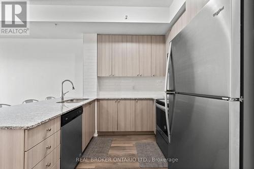 408 - 65 Yorkland Boulevard, Brampton, ON - Indoor Photo Showing Kitchen With Stainless Steel Kitchen With Double Sink