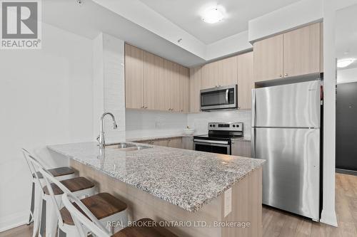 408 - 65 Yorkland Boulevard, Brampton, ON - Indoor Photo Showing Kitchen With Stainless Steel Kitchen With Double Sink With Upgraded Kitchen