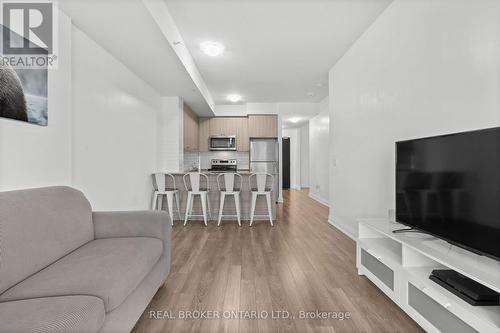 408 - 65 Yorkland Boulevard, Brampton, ON - Indoor Photo Showing Living Room With Fireplace