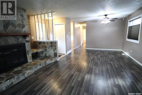 278 Trifunov Crescent, Regina, SK - Indoor Photo Showing Living Room With Fireplace