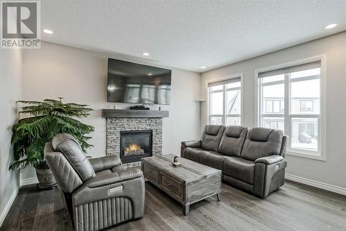 34 Mahogany Close Se, Calgary, AB - Indoor Photo Showing Living Room With Fireplace