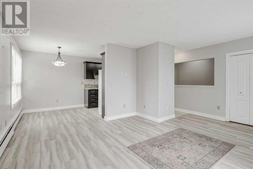 202, 219 Huntington Park Bay Nw, Calgary, AB - Indoor With Fireplace