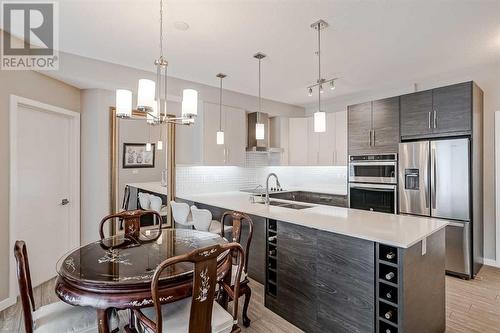 605, 122 Mahogany Centre Se, Calgary, AB - Indoor Photo Showing Kitchen With Stainless Steel Kitchen With Double Sink With Upgraded Kitchen