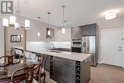 605, 122 Mahogany Centre Se, Calgary, AB - Indoor Photo Showing Kitchen With Stainless Steel Kitchen With Double Sink With Upgraded Kitchen