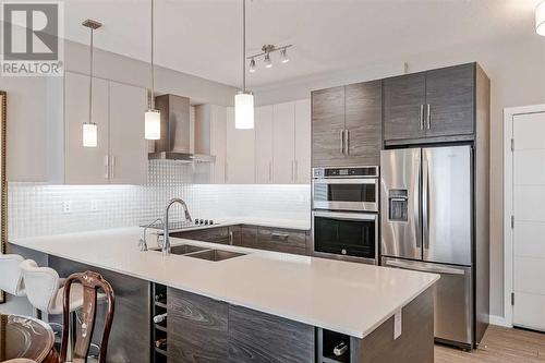 605, 122 Mahogany Centre Se, Calgary, AB - Indoor Photo Showing Kitchen With Stainless Steel Kitchen With Double Sink With Upgraded Kitchen