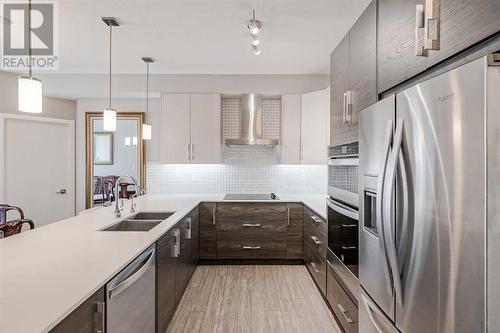 605, 122 Mahogany Centre Se, Calgary, AB - Indoor Photo Showing Kitchen With Stainless Steel Kitchen With Double Sink With Upgraded Kitchen