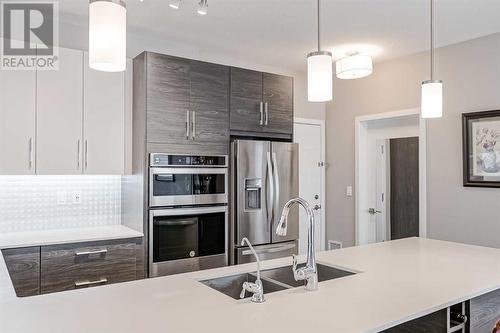 605, 122 Mahogany Centre Se, Calgary, AB - Indoor Photo Showing Kitchen With Stainless Steel Kitchen With Double Sink With Upgraded Kitchen