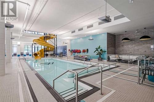 605, 122 Mahogany Centre Se, Calgary, AB - Indoor Photo Showing Other Room With In Ground Pool