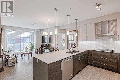 605, 122 Mahogany Centre Se, Calgary, AB - Indoor Photo Showing Kitchen With Double Sink With Upgraded Kitchen