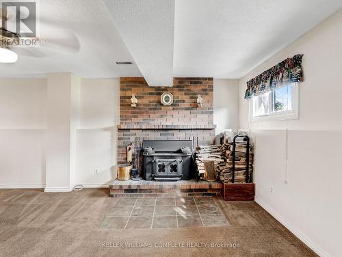 103 Williamson Drive, Haldimand, ON - Indoor Photo Showing Other Room With Fireplace