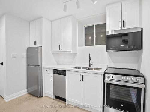 5-2563 Dundas St W, Toronto, ON - Indoor Photo Showing Kitchen With Double Sink