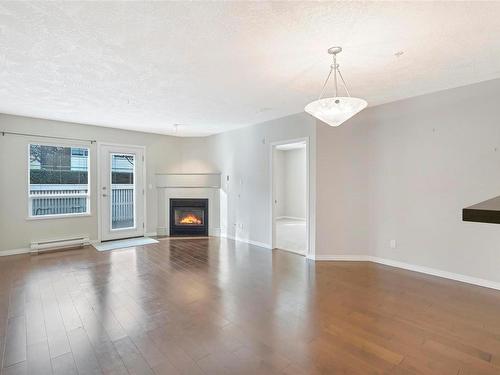 110-380 Waterfront Cres, Victoria, BC - Indoor Photo Showing Living Room With Fireplace