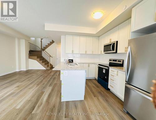 102 - 1565 Rose Way, Milton, ON - Indoor Photo Showing Kitchen With Stainless Steel Kitchen