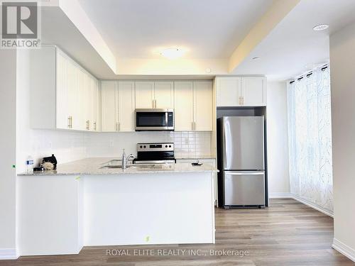 102 - 1565 Rose Way, Milton, ON - Indoor Photo Showing Kitchen With Stainless Steel Kitchen