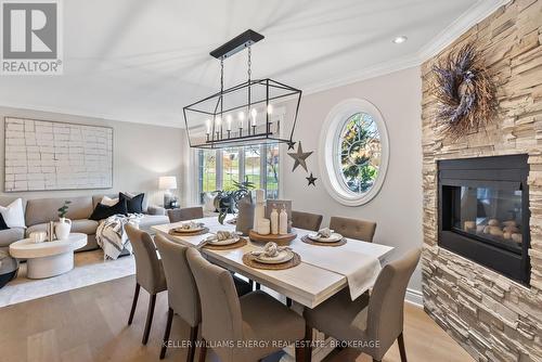 334 Decimal Place, Toronto (Rouge), ON - Indoor Photo Showing Dining Room With Fireplace